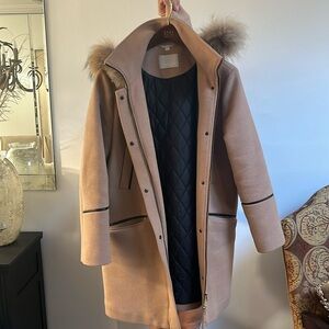 Perfect condition with real fur lined hood. Black leather pipping